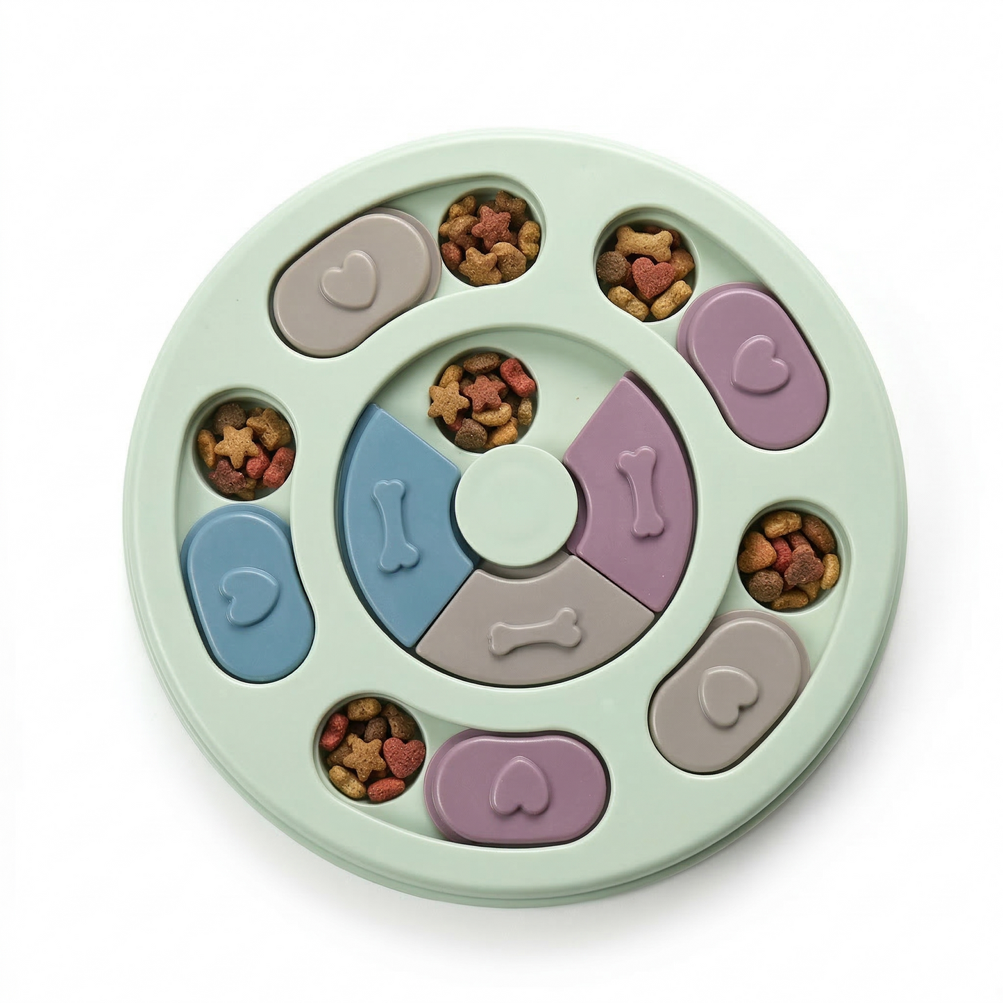 Puppy using dog puzzle feeder sliding pieces to uncover kibble during interactive feeding activity